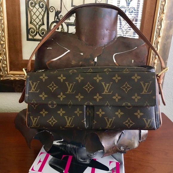 Louis Vuitton Handbags - 💯Auth Louis Vuitton Viva Cite Handbag $1100 EUC!